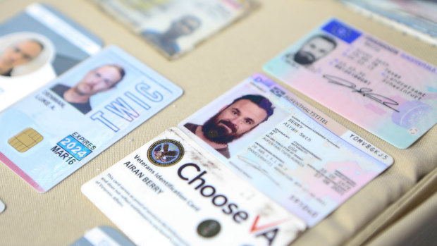 Venezuelan authorities show what they say are the ID cards of former US special forces citizen Airan Berry, right, and Luke Denman, left, in Caracas, Venezuela. 