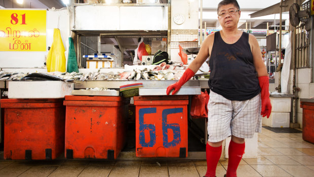 A fish seller in a wet market in Little India, Singapore.