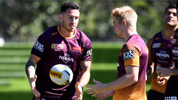 Brisbane Broncos captain Darius Boyd (left) training with teammate Tom Dearden on Thursday. 'I love his attitude and I'm going to stick with him,' says coach Seibold.