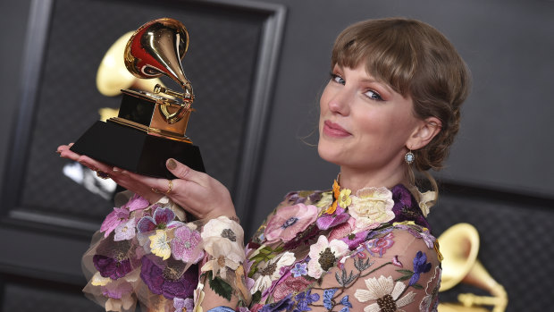 Swift with her award for Album of the Year for Folklore at the 63rd annual Grammy Awards in Los Angeles on March 14. 