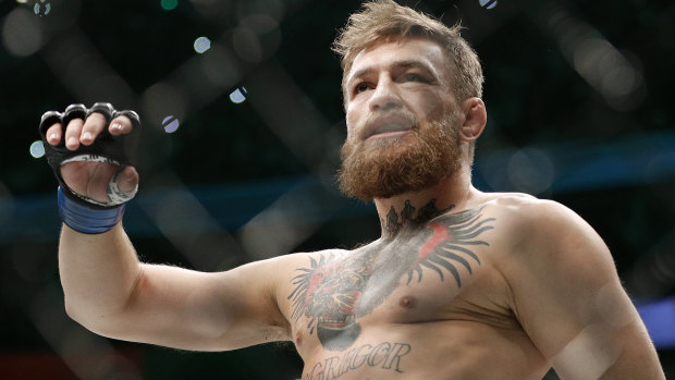 Conor McGregor has settled with a fan whose phone was smashed by the retired star.