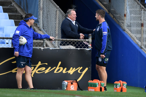 Bulldogs legend Terry Lamb greets Kieran Foran before training on Thursday.