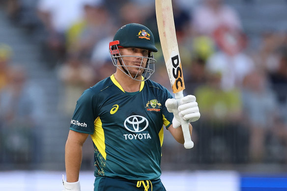 Warner raises the bat for his 26th T20 half-century.