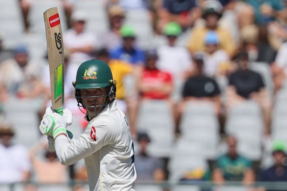 Australia’s Alex Carey plays a shot on day three.
