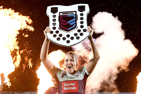 Ali Brigginshaw holds the Origin shield aloft. 