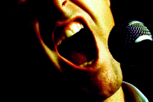 I’m witnessing a crime. “He’s murdering John Farnham’s You’re The Voice.”