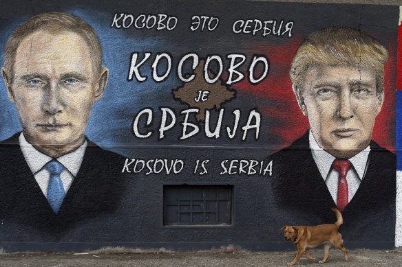 A graffiti depicting the Russian President Vladimir Putin and US President Elect Donald Trump with Cyrillic script that reads "Kosovo is Serbia" in a suburb of Belgrade, Serbia in 2016.