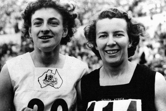 Marjorie Jackson (left) and Daphne Hasenjager of South Africa, winner and runner-up, after the 100m final in Helsinki.