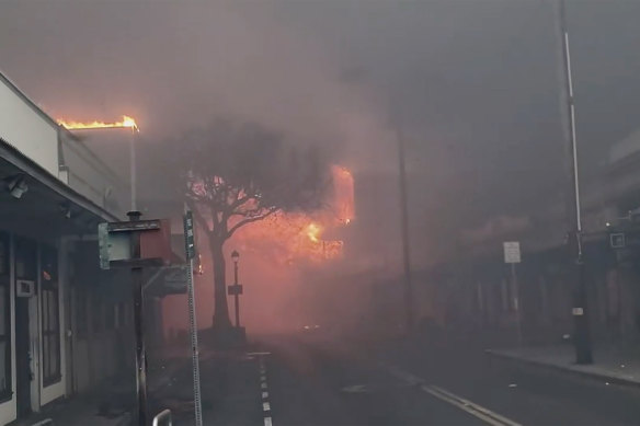 Smoke and flames fill the air from raging wildfires on Front Street in downtown Lahaina, Maui on Tuesday.