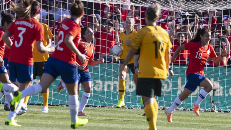 Insult to injury: Yesenia Huenteo races off after adding to the Matildas' woes.