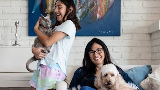 Christina Caddy-Gold with her daughter Avalon and two of their pets, Atlantis the cat and Cappuccino the dog.