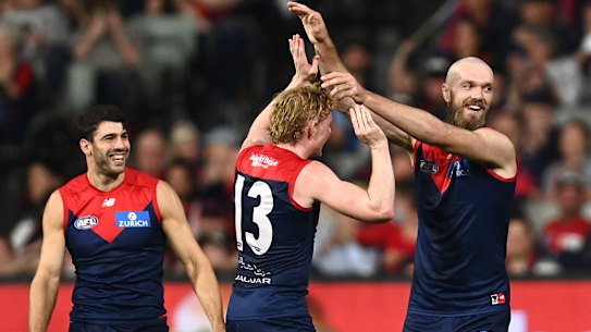 Christian Petracca, Clayton Oliver, and Max Gawn.