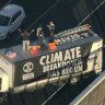 Deanna ‘Violet’ Coco, Bradley Homewood and Joseph Zammit climbed onto the roof of a truck parked across three lanes of traffic on the West Gate Bridge.