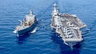 USS Gerald R. Ford aircraft carrier (right) refuels in the Mediterranean Sea in 2023.