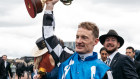 Winning jockey Mark Zahra with the Melbourne Cup. 