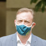 Masks are again mandatory indoors in Queensland as cases accelerate