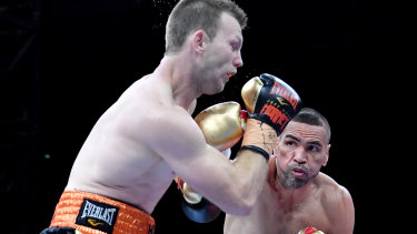 Hit and miss: Anthony Mundine lands a rare punch against Jeff Horn in Brisbane.