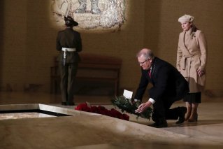 Prime Minister Scott Morrison and Jenny Morrison lay a wreath at the Tomb of the Unknown Australian Soldier during the Anzac Day commemorative service at the Australian War Memorial in Canberra on Saturday 25 April 2020. 