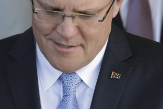 The Prime Minister gave all his ministers an Australian flag lapel pin.