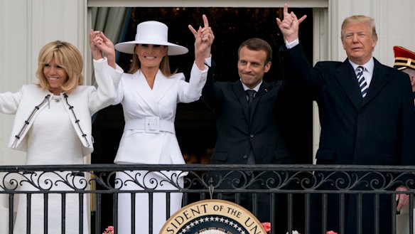 Trump and Macron, with their wives Melania Trump and Brigitte Macron, wave from the Truman Balcony during a State Arrival ceremony on the South Lawn.