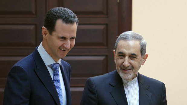 Syrian President Bashar al- Assad, left, meets with Ali Akbar Velayati, an adviser to Iran's Supreme Leader Ayatollah Ali Khamenei, in Damascus, last month.
