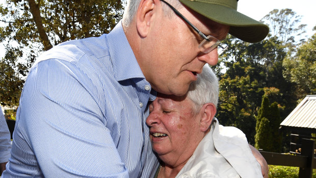 Prime Minister Scott Morrison consoles bushfire victim Pamela Skeen, who lost her home at Binna Burra in the Gold Coast hinterland.