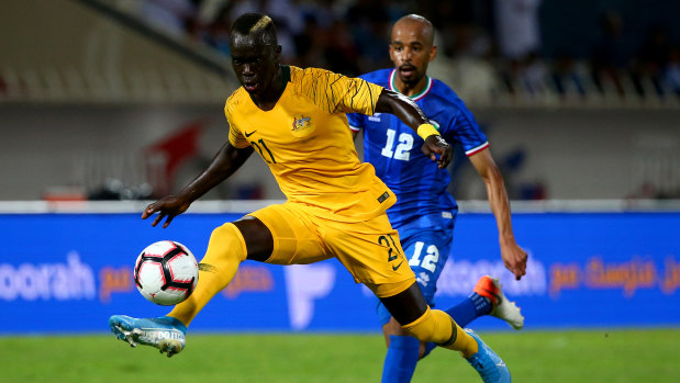 Close control: The typically dynamic Awer Mabil on the ball against Kuwait.