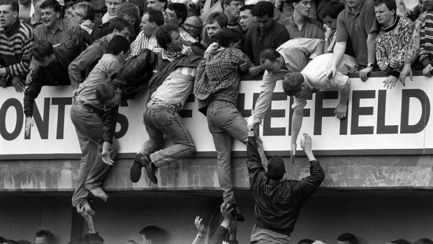 Liverpool fans trying to escape during the Hillsborough disaster at Hillsborough football stadium in Sheffield.