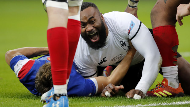 We have overcome: Semi Radradra scores for Fiji in their historic Test win over France in Paris last month. 