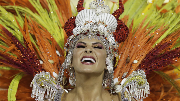 A performer from the Paraiso do Tuiuti samba school parades during Carnival celebrations at the Sambadrome in Rio de Janeiro, Brazil.