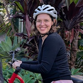 Brisbane woman Kim Fisher, who rides an electric cargo bike, is dismayed about the proposed restrictions on e-bikes.