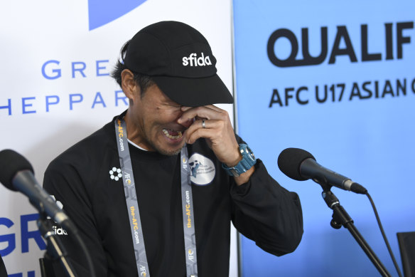 Michiteru Mita, the Northern Mariana Islands coach, breaks down after his side’s game against China.