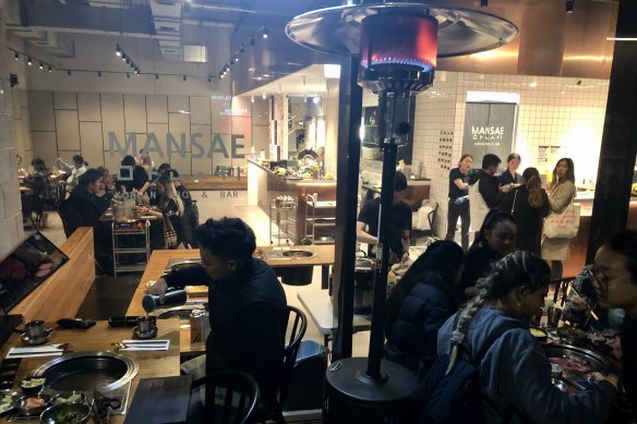 Diners at a Melbourne city restaurant enjoy their last chance to eat in on Wednesday evening in the hours before lockdown.