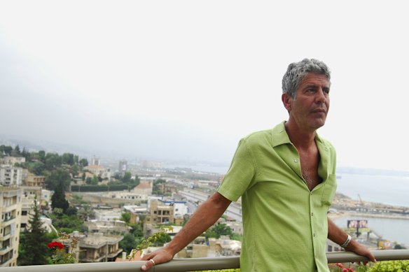 Bourdain in front of the Beirut cityscape.