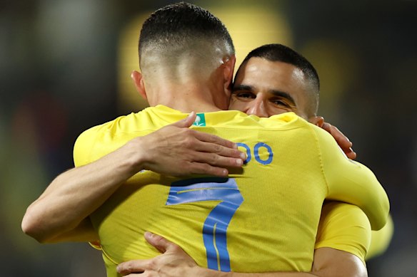 Cristiano Ronaldo of Al Nassr celebrates scoring his team’s second goal with Aziz Behich in February 2024.