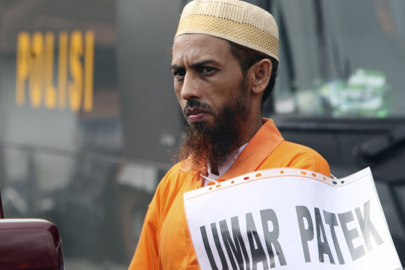 Umar Patek pauses during the police reenactment of the scenes leading to the 2002 Bali bombing, in Denpasar, in October 2011.