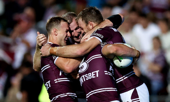 The Sea Eagles celebrate a try by Kieran Foran on Saturday.