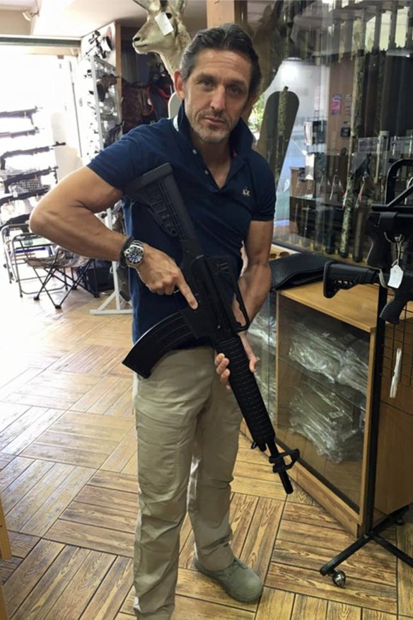 Christian Madison, pictured here with an assault rifle, put Hartford Investments into administration with debts of more than $5 million just weeks after Peter Larcombe's death.