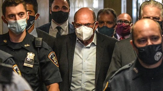 Allen Weisselberg, chief financial officer of Trump Organisation, centre, walks towards a courtroom in New York.