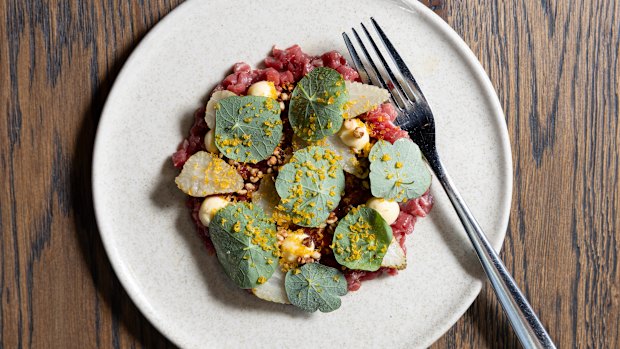 Beef tartare with green strawberries.