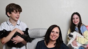 Emma Shannon, in her home office with her children, quit her job and founded her own recruitment company to better manage her career and caring responsibilities.