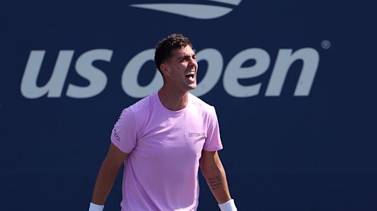 An elated Thanasi Kokkinakis celebrates his four-set upset of Stefanos Tsitsipas at the US Open.