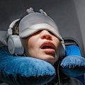 Essentials: Eye mask, noise-cancelling earphones and a neck pillow.