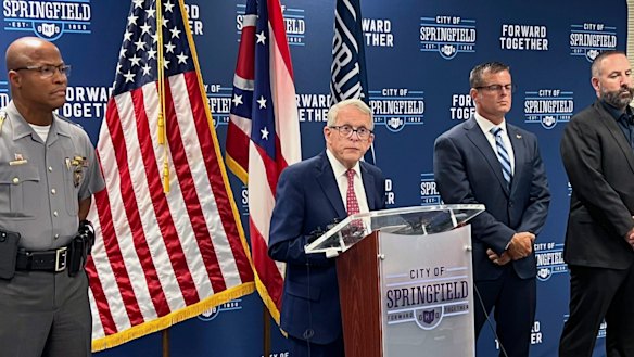 Republican Ohio Governor Mike DeWine (centre) holds a news conference in Springfield.