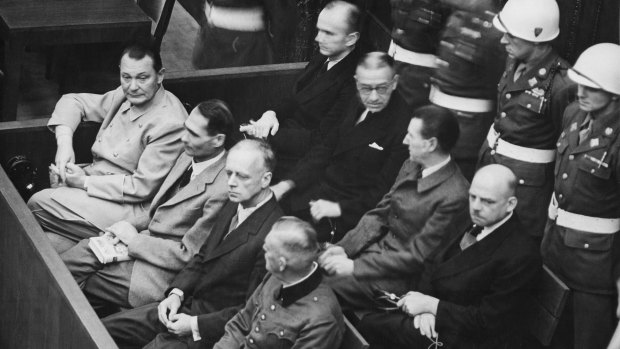 The defendants in the dock: [front row, L-R]: Hermann Goering, Rudolf Hess, Joachim von Ribbentrop, Wilhelm Keitel. [second row, L-R]: Karl Dönitz, Erich Raeder, Baldur von Schirach, Fritz Sauckel.