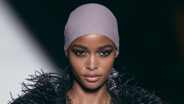 A model wearing a head scarf, one of the signature looks at the Tom Ford show.