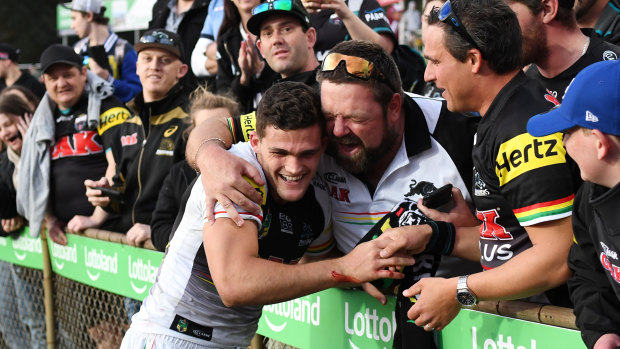 Central figure: Nathan Cleary is embraced by Panthers supporters after his starring role in the defeat of Manly.
