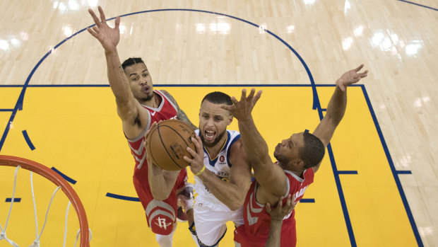 Stephen Curry shoots in the big game three win over the Rockets.