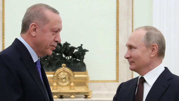 Russian President Vladimir Putin, right, and Turkish President Recep Tayyip Erdogan meet in the Kremlin.