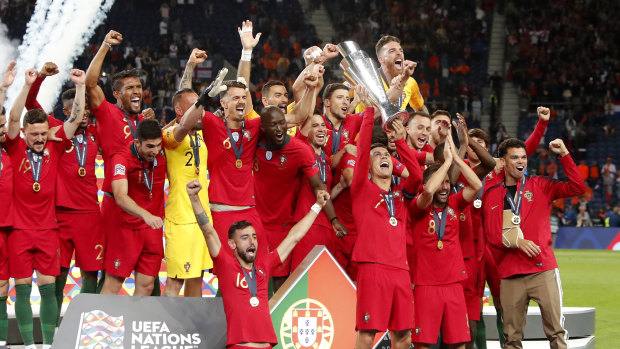 Inaugural: Cristiano Ronaldo holds aloft the Nations League trophy.